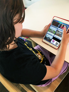 young girl using an app for speaking