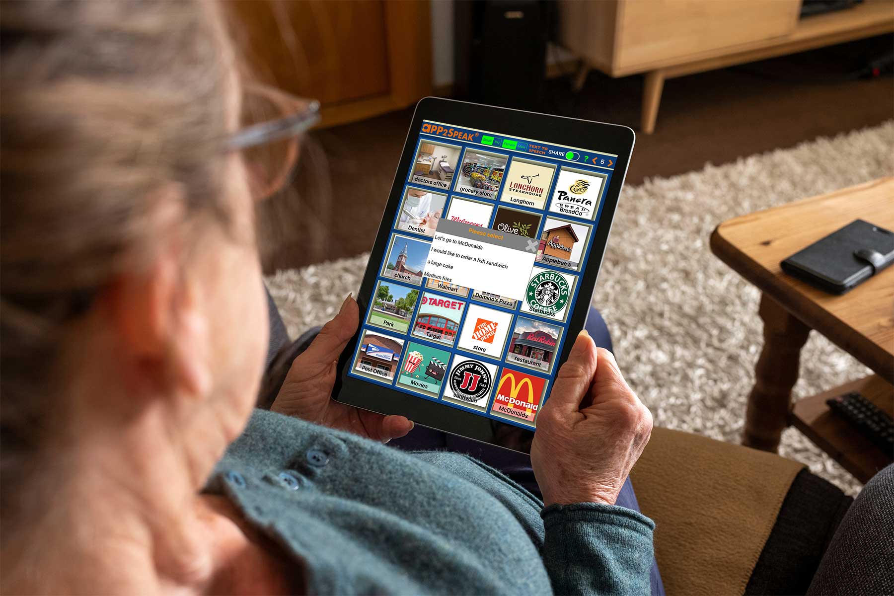 Woman using iPad app2speak