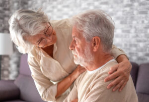 senior woman worried about her husband who has dementia